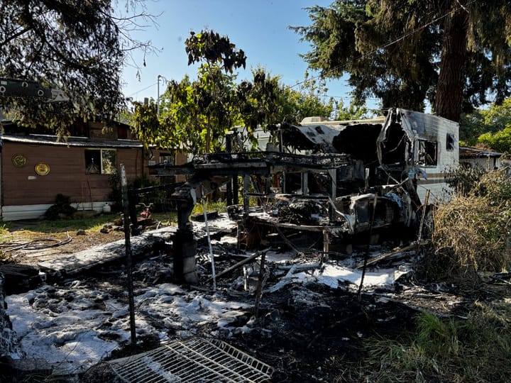 RV Fire In Dillard Damages Utility Lines, Spreads To Nearby Trees